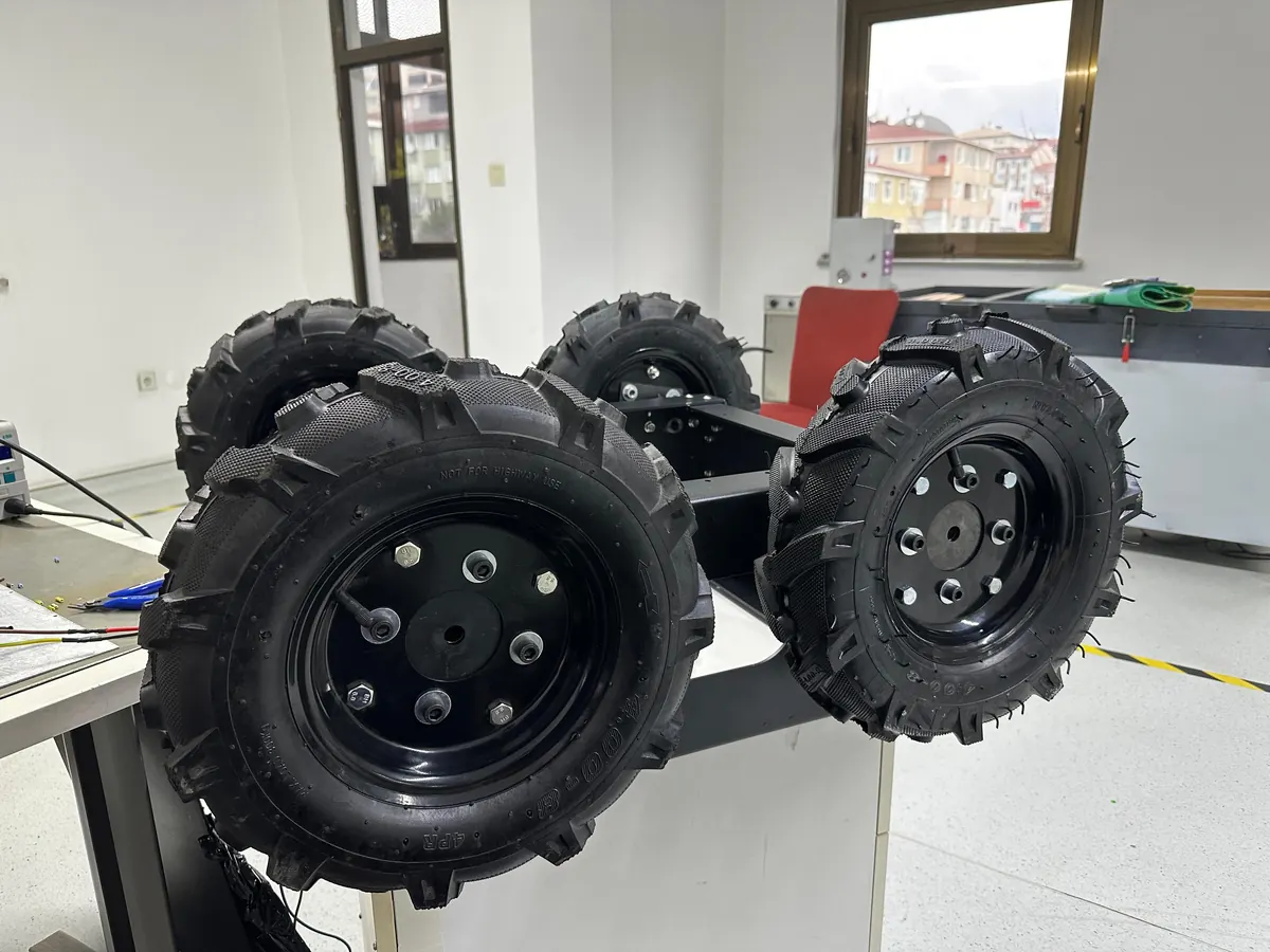 All-terrain wheels and drivetrain parts of the greenhouse robot in the workshop